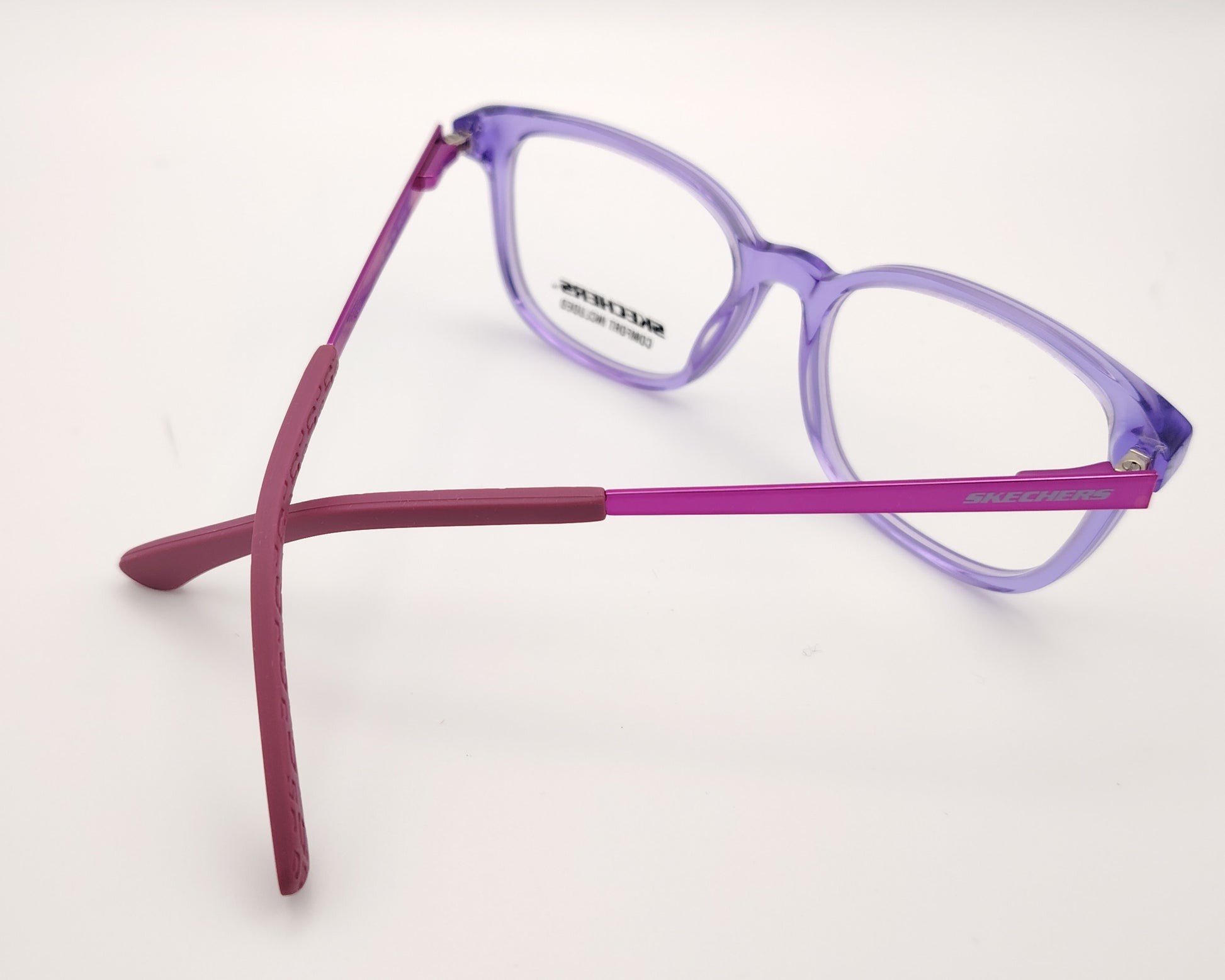 gafas graduadas skechers infantiles lilas translúcidas con varillas de metal rosa