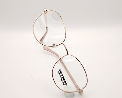 gafas graduadas infantiles skechers metalizadas rosa claro con forma redondeada
