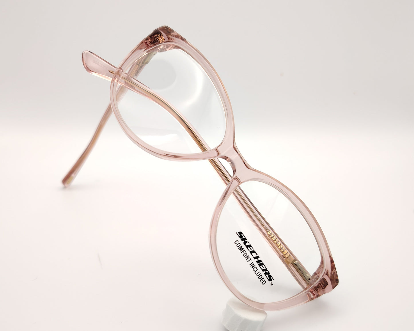 gafas graduadas skechers infantiles rosas translúcidas forma de mariposa redondeada