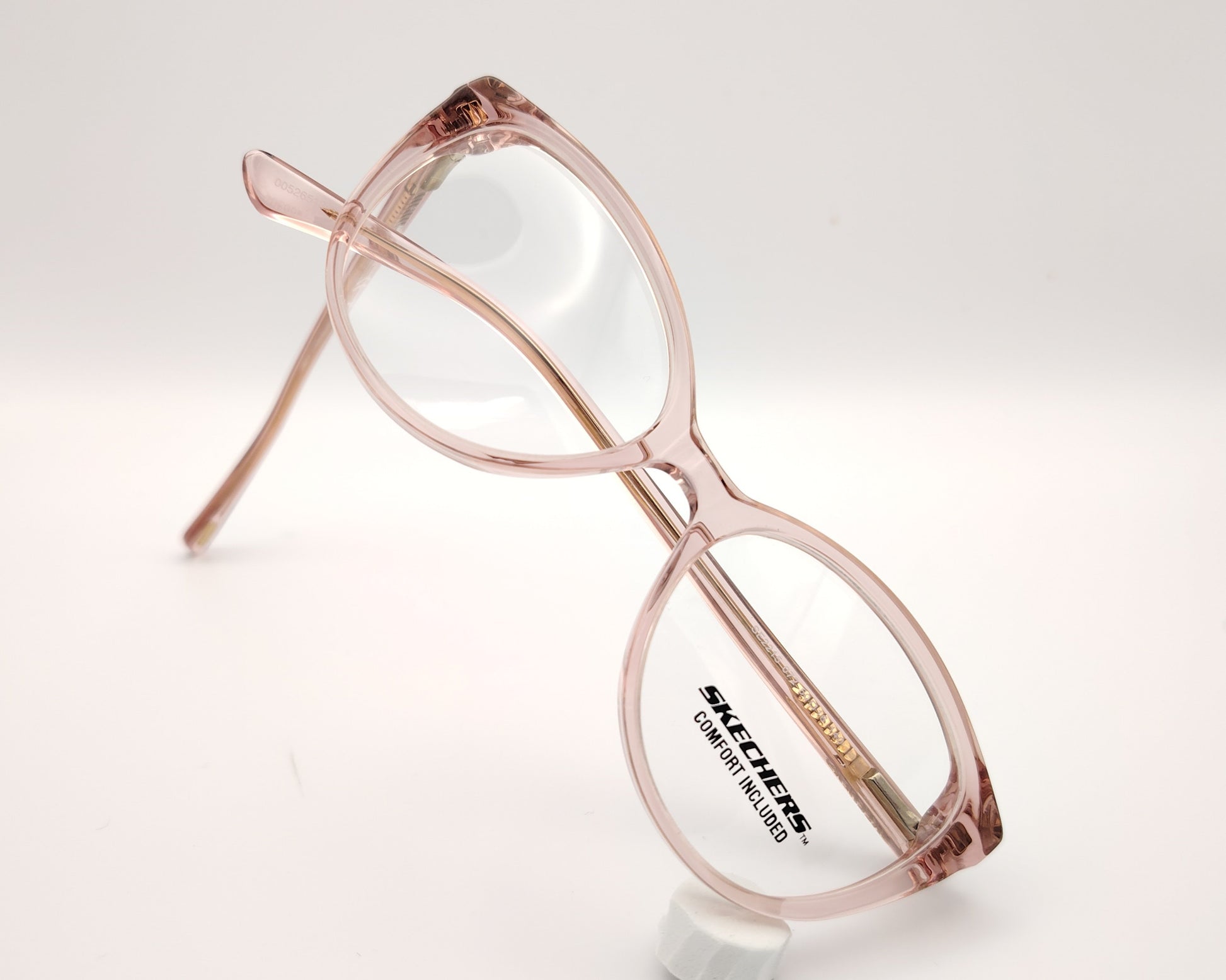 gafas graduadas skechers infantiles rosas translúcidas forma de mariposa redondeada
