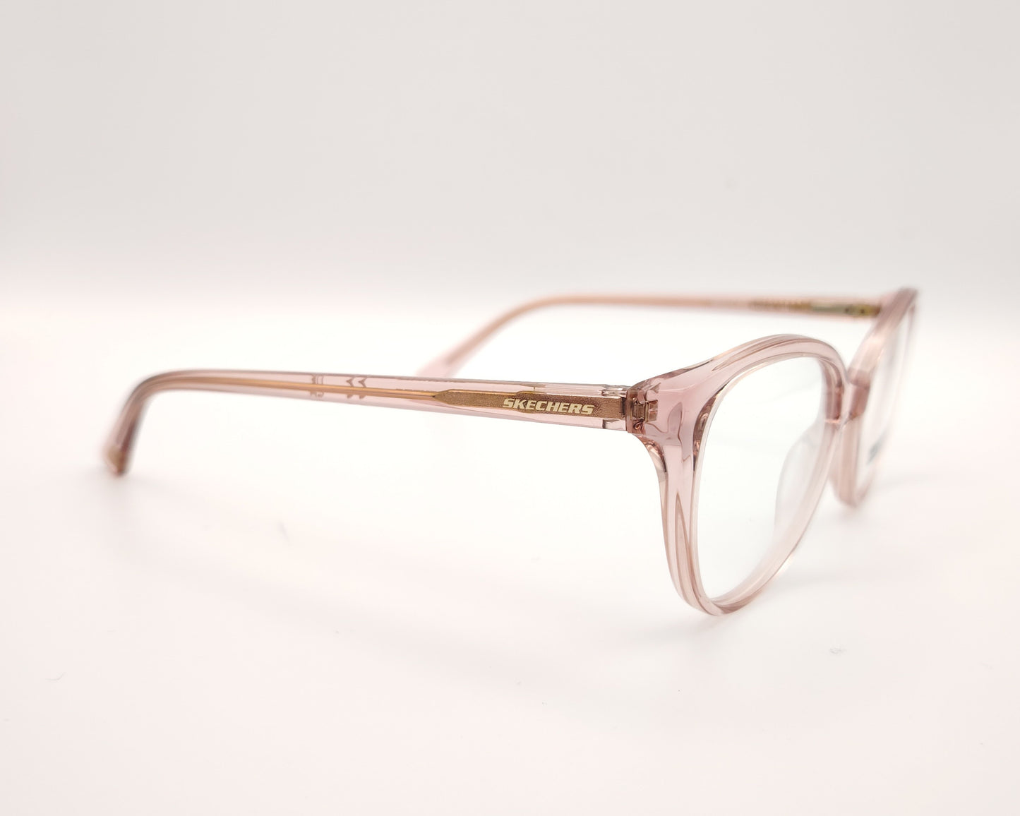 gafas graduadas skechers infantiles rosas translúcidas forma de mariposa redondeada