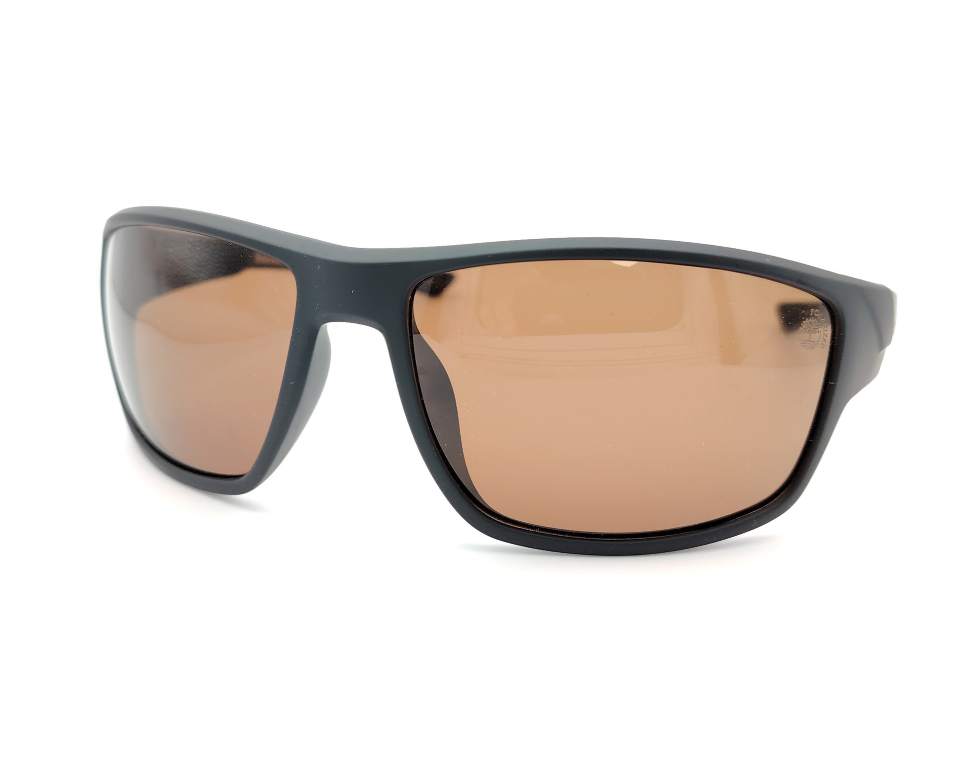 gafas de sol negras mate polarizadas con lentes marron y diseño deportivo envolvente