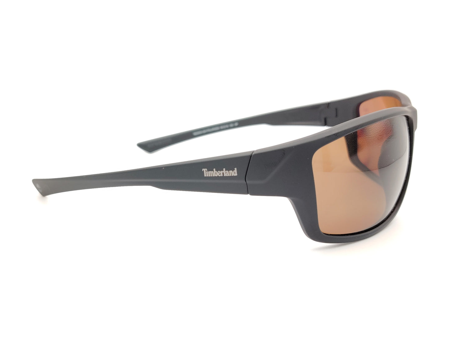 gafas de sol negras mate polarizadas con lentes marron y diseño deportivo envolvente