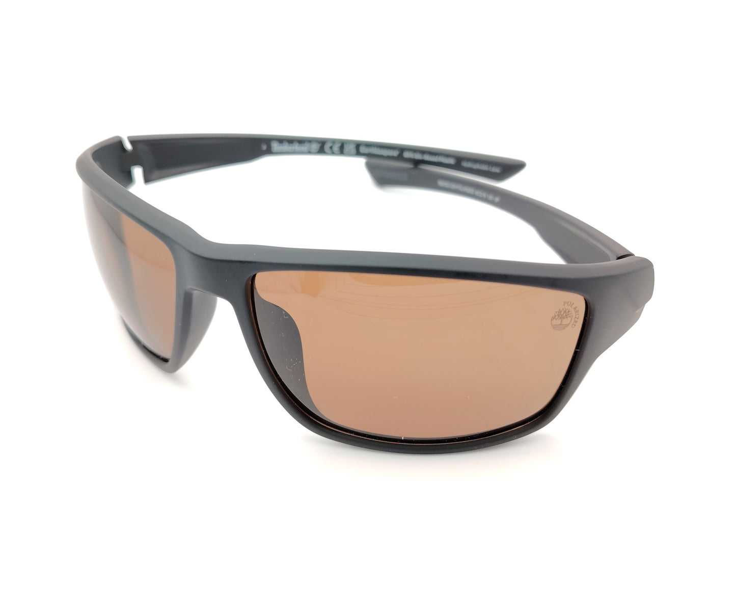 gafas de sol negras mate polarizadas con lentes marron y diseño deportivo envolvente