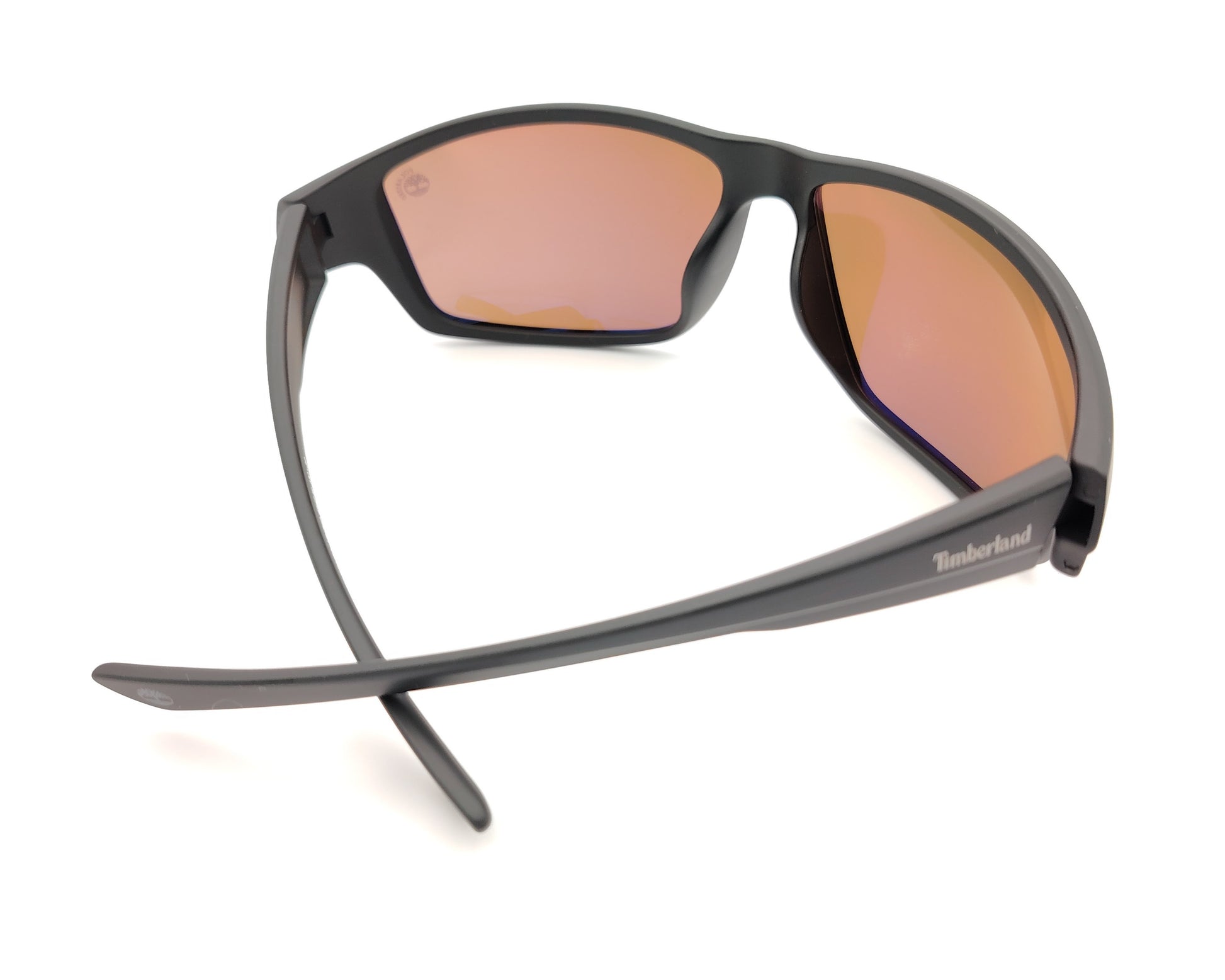gafas de sol negras mate polarizadas con lentes marron y diseño deportivo envolvente