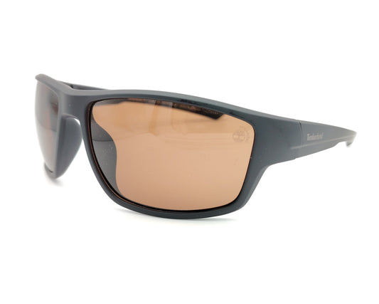 gafas de sol negras mate polarizadas con lentes marron y diseño deportivo envolvente