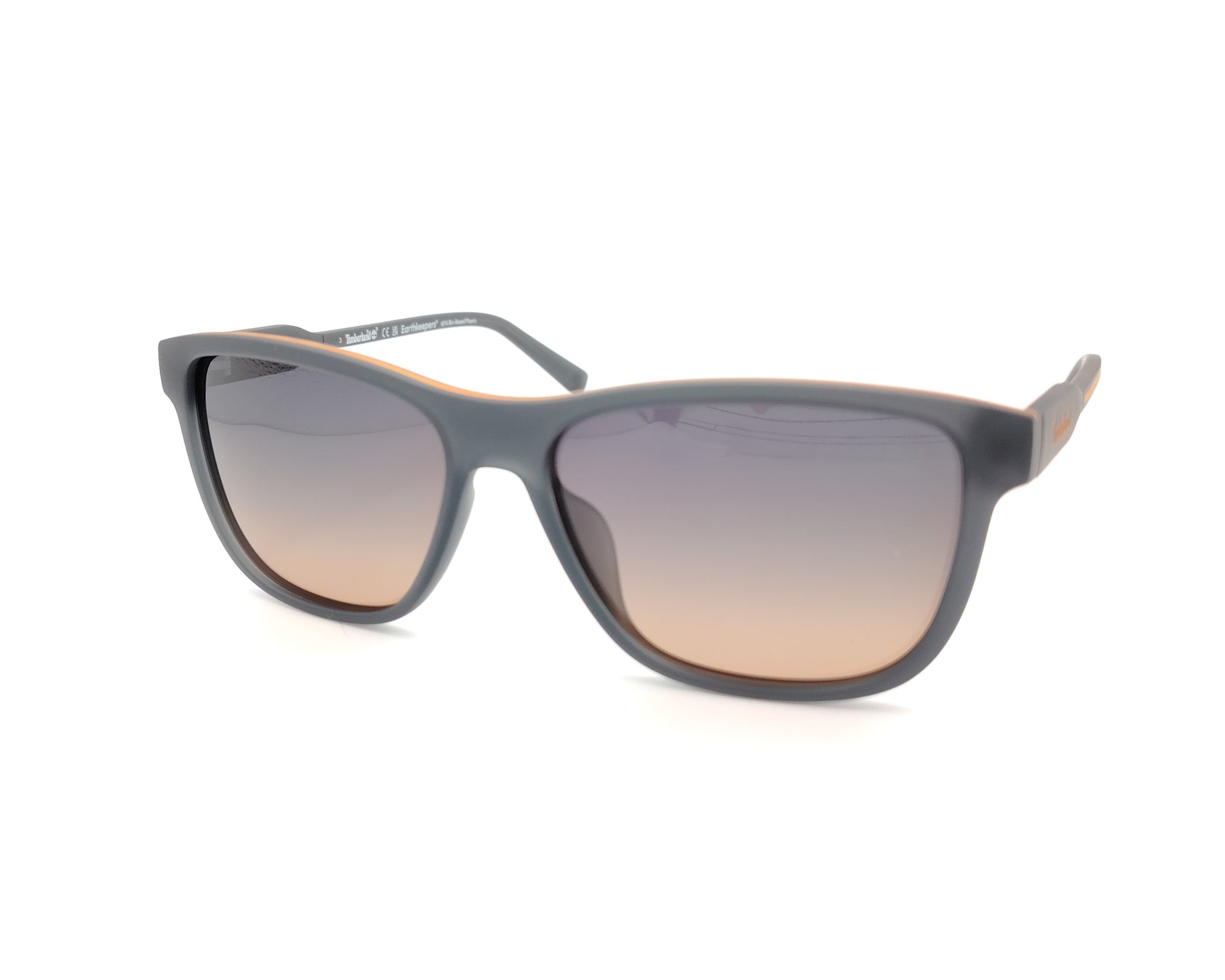 gafas de sol gris mate polarizadas con lentes marron degradado y detalle naranja en varillas