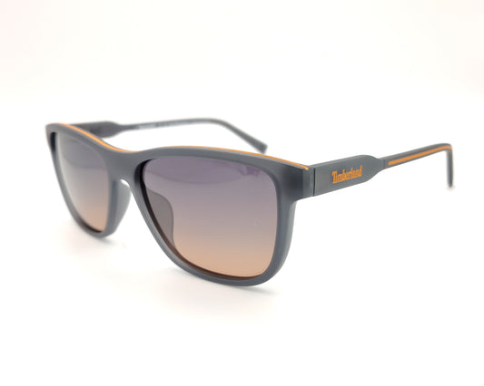 gafas de sol gris mate polarizadas con lentes marron degradado y detalle naranja en varillas