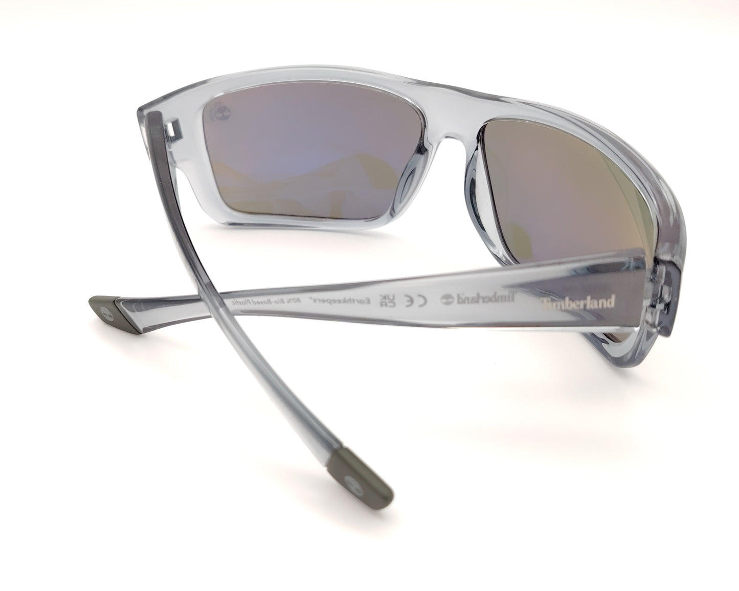 gafas de sol polarizadas gris translucido con lentes espejo iridiscentes azul y verde