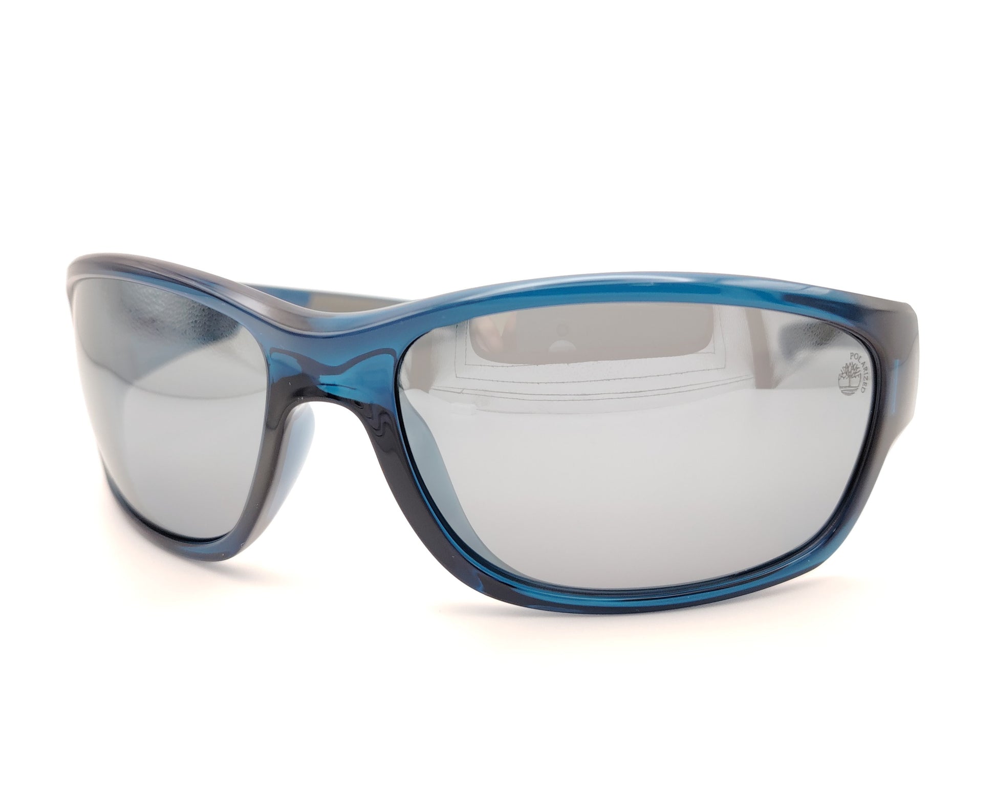 gafas de sol polarizadas azul translúcido con lentes espejo gris y diseño deportivo envolvente