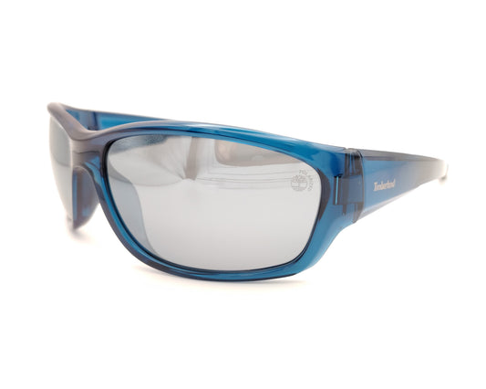 gafas de sol polarizadas azul translúcido con lentes espejo gris y diseño deportivo envolvente