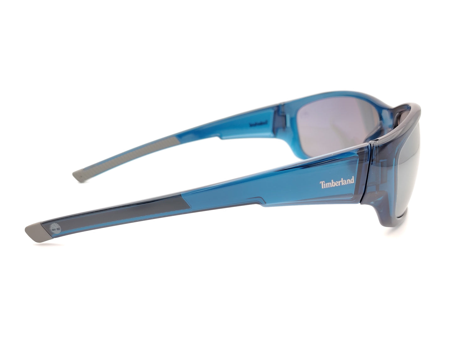 gafas de sol polarizadas azul translúcido con lentes espejo gris y diseño deportivo envolvente