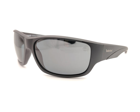 gafas de sol en negro mate polarizadas con diseño envolvente y lentes gris