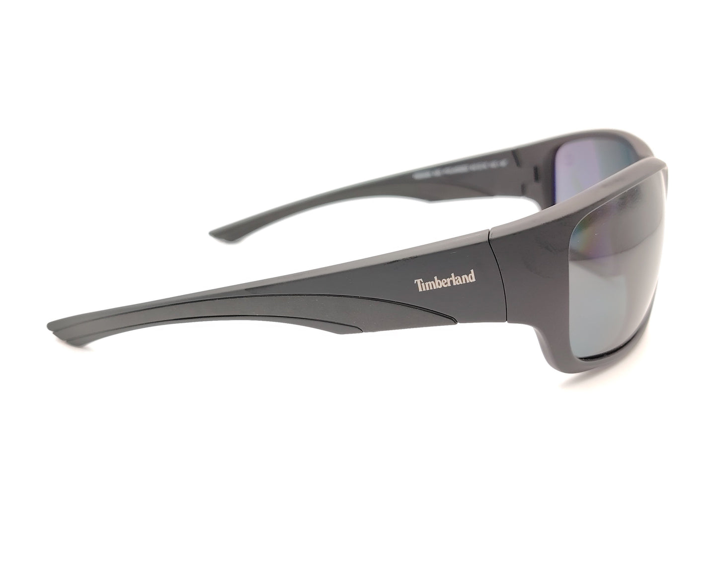 gafas de sol en negro mate polarizadas con diseño envolvente y lentes gris
