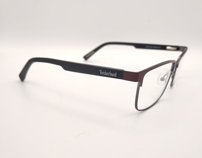 gafas de vista timberland con montura rectangular de metal en color burdeos y gris plomo con varillas negras de acabado mate
