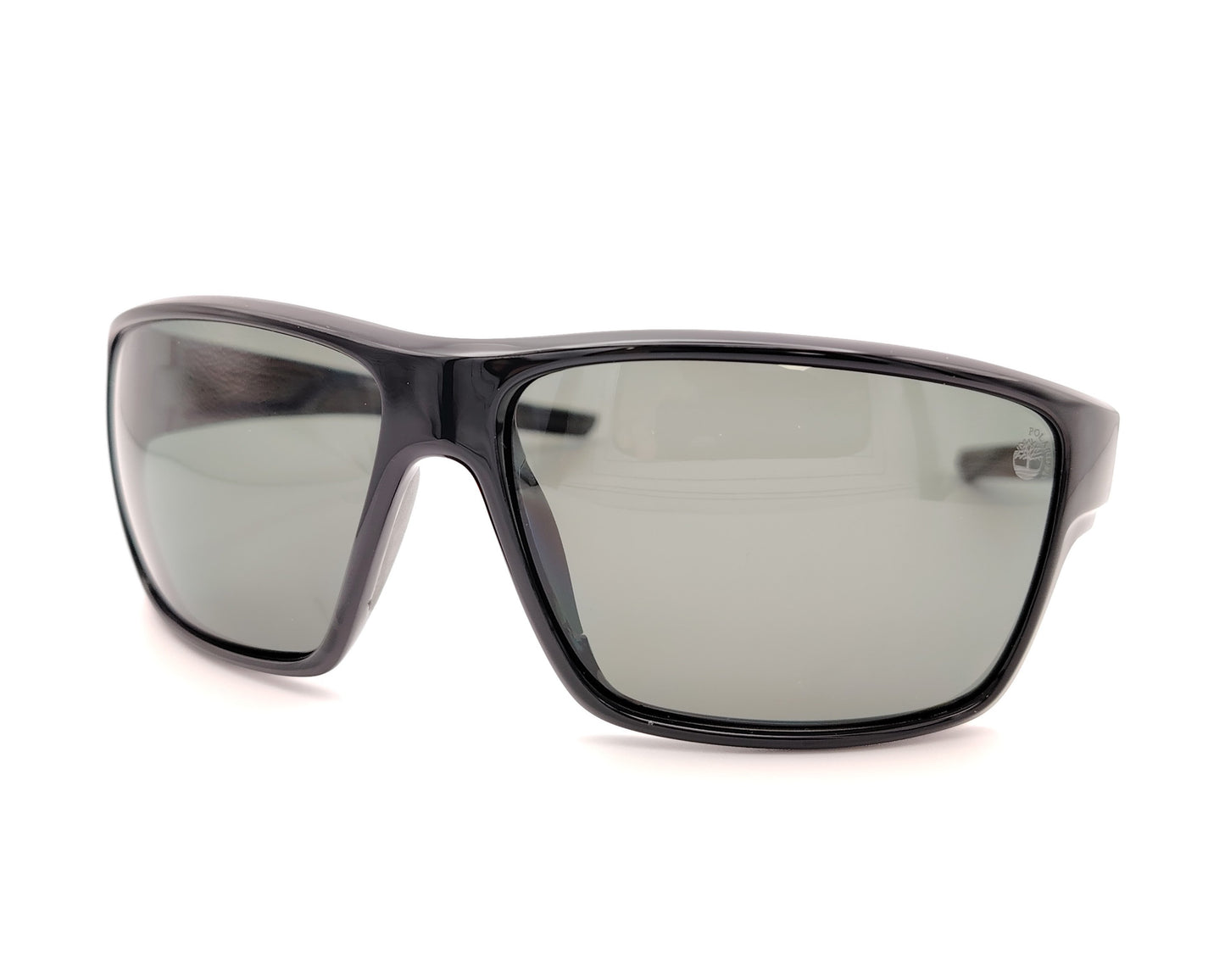gafas de sol negras polarizadas con lentes gris y diseño deportivo envolvente