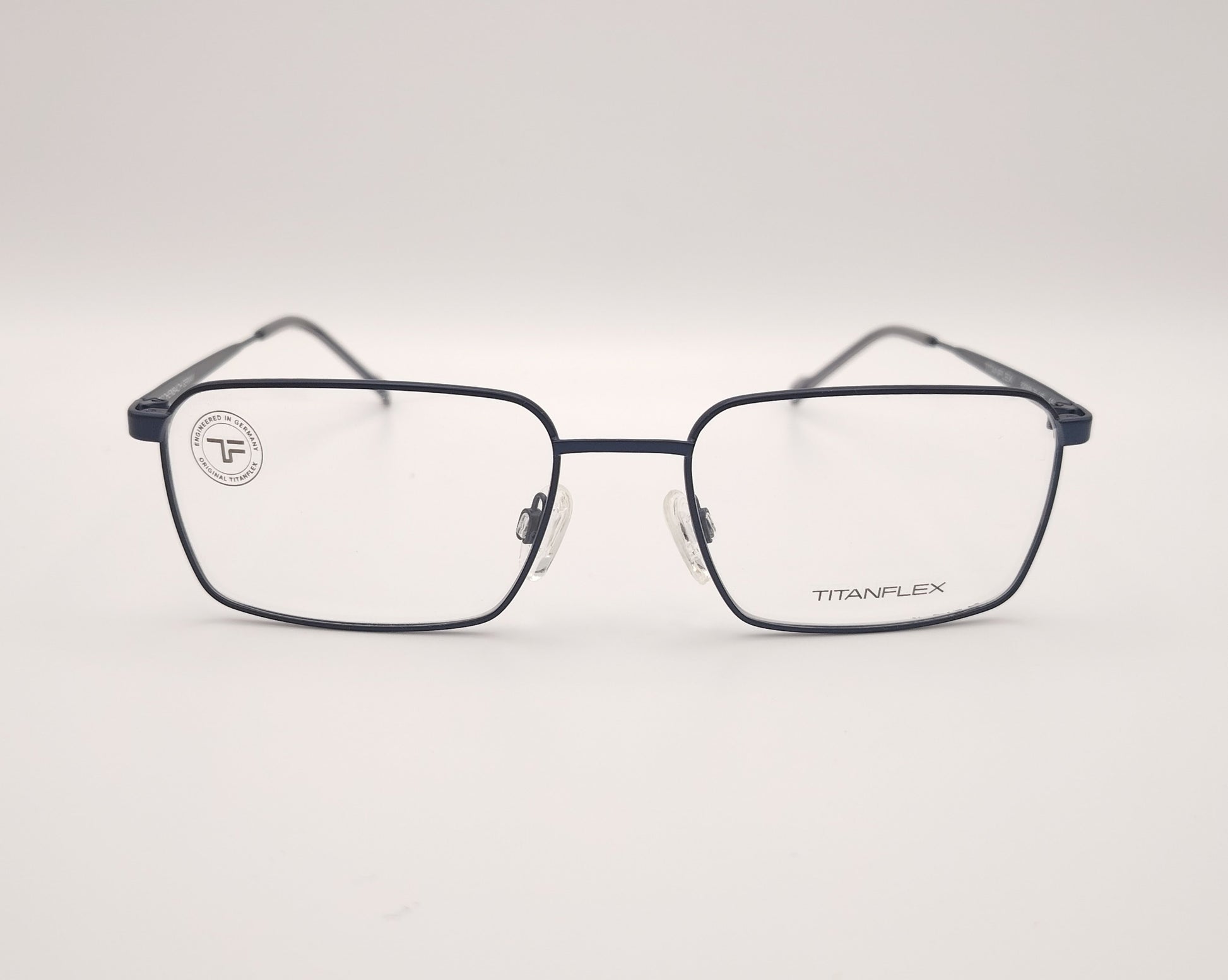 gafas titanflex rectangulares azul marino con montura metálica ligera y varillas finas