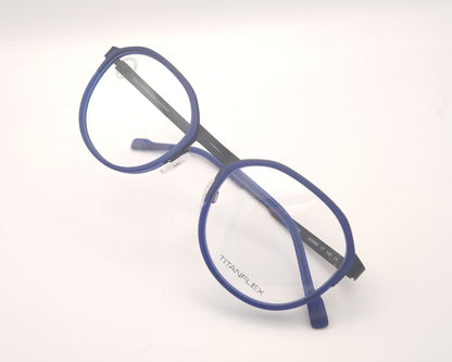 gafas titanflex redondas con frontal azul translúcido y varillas metálicas negras