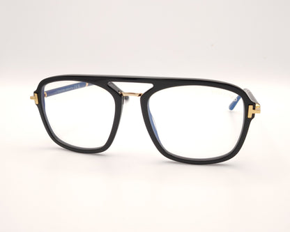 gafas tom ford negras con puente metálico y detalles dorados en frontal y patillas