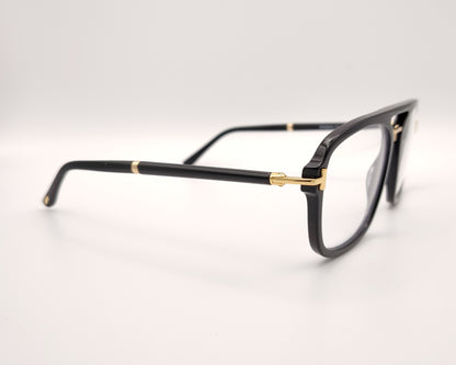 gafas tom ford negras con puente metálico y detalles dorados en frontal y patillas