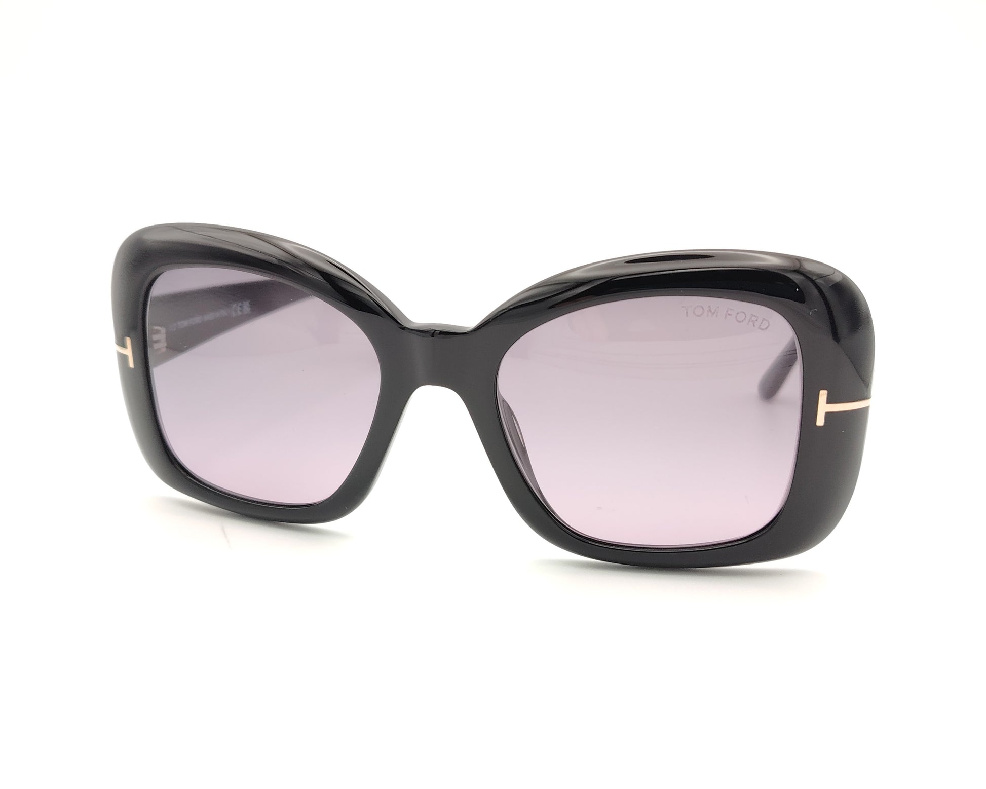 gafas de sol tom ford negras oversize con lentes violetas y detalle metálico en las varillas