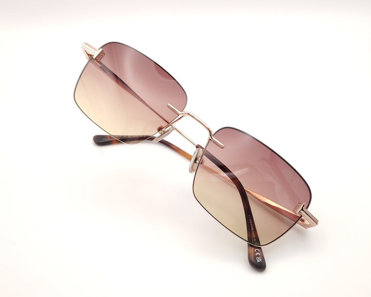 gafas de sol tom ford sin montura doradas con lentes degradadas rosa y ámbar rectangulares
