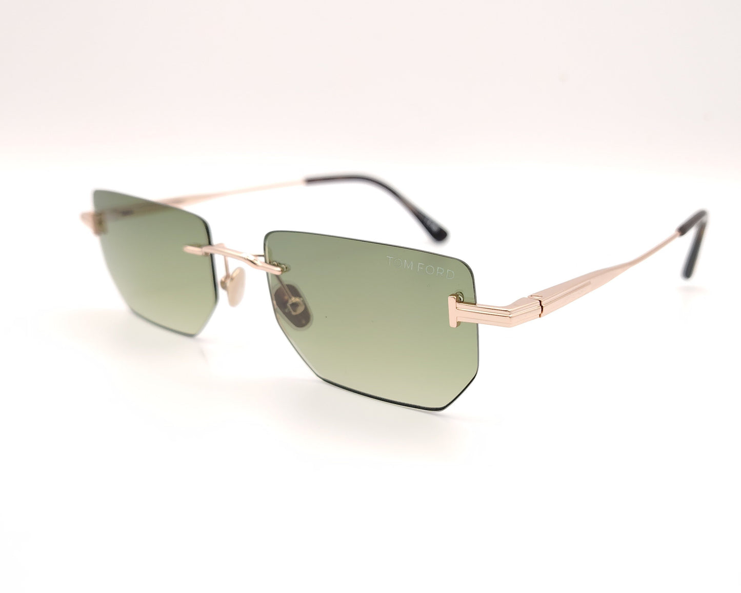 gafas de sol tom ford sin montura con lentes verdes y varillas metálicas doradas