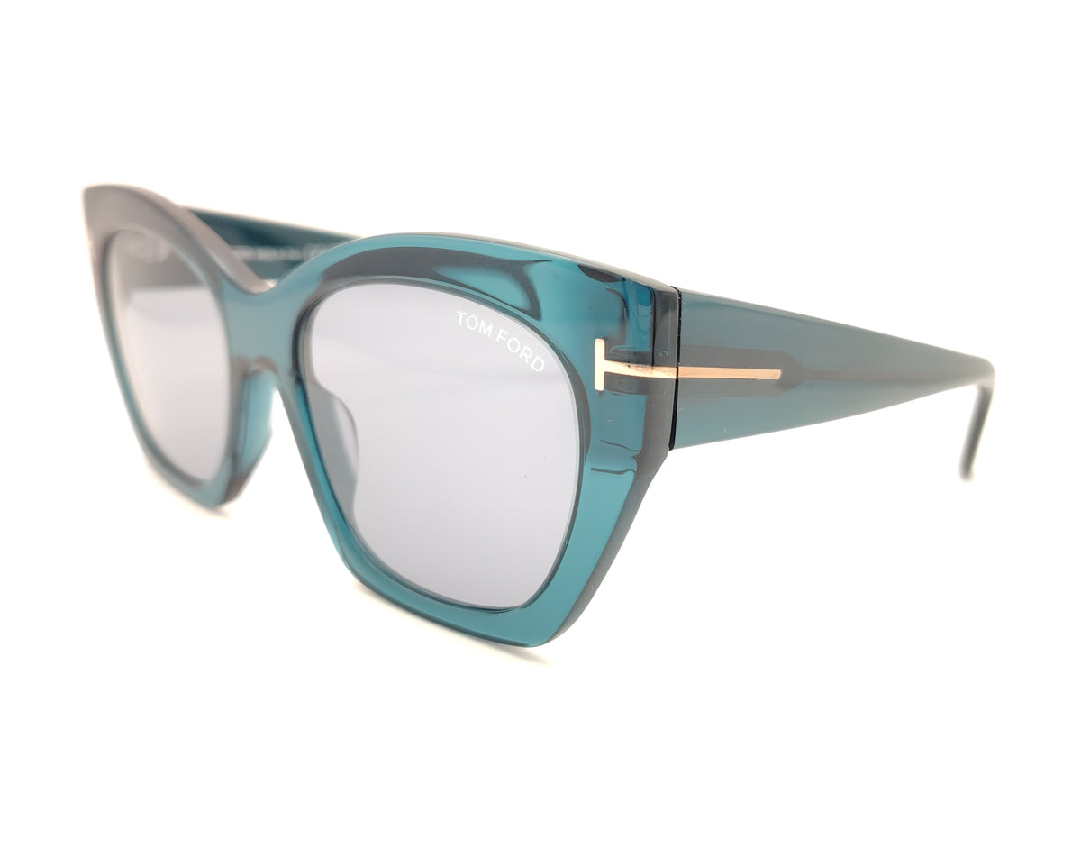gafas tom ford oversize en azul petróleo translúcido con detalle metálico dorado