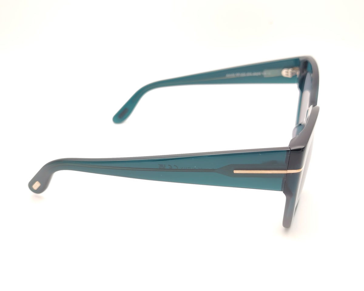 gafas tom ford oversize en azul petróleo translúcido con detalle metálico dorado
