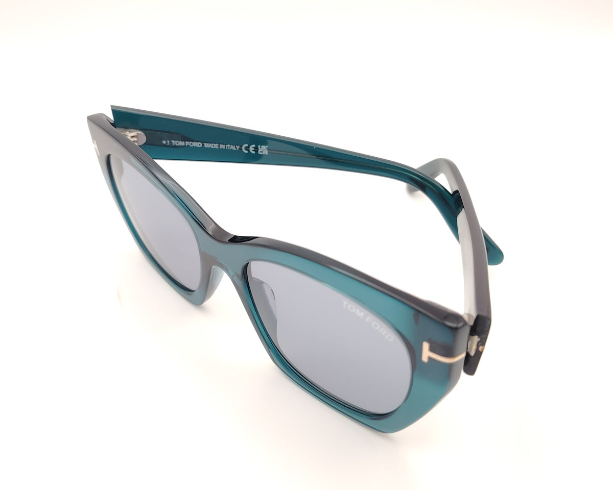 gafas tom ford oversize en azul petróleo translúcido con detalle metálico dorado