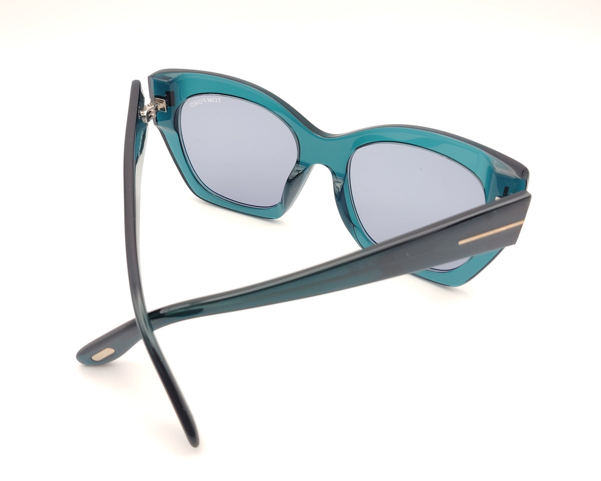 gafas tom ford oversize en azul petróleo translúcido con detalle metálico dorado