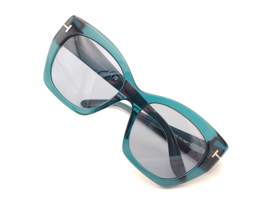 gafas tom ford oversize en azul petróleo translúcido con detalle metálico dorado