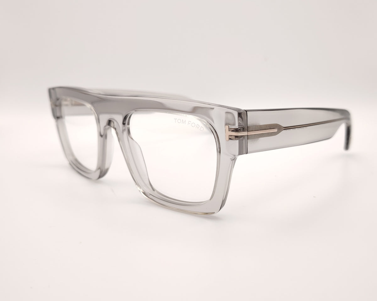 gafas graduadas de forma cuadrada con montura gruesa en gris traslúcido y detalle metálico dorado en las varillas