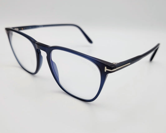 gafas graduadas con montura fina azul marino y detalle metálico en forma de T en las varillas