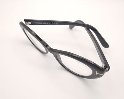 gafas tom ford negras ovaladas de acetato con detalle metálico en las varillas