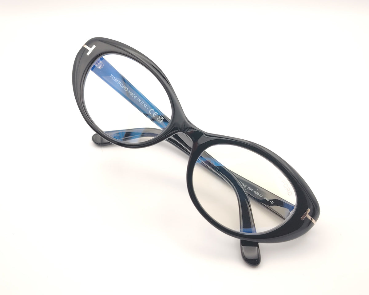 gafas tom ford negras ovaladas de acetato con detalle metálico en las varillas