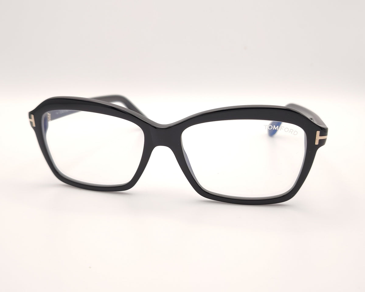 gafas tom ford negras con montura cuadrada y detalles metálicos en las varillas