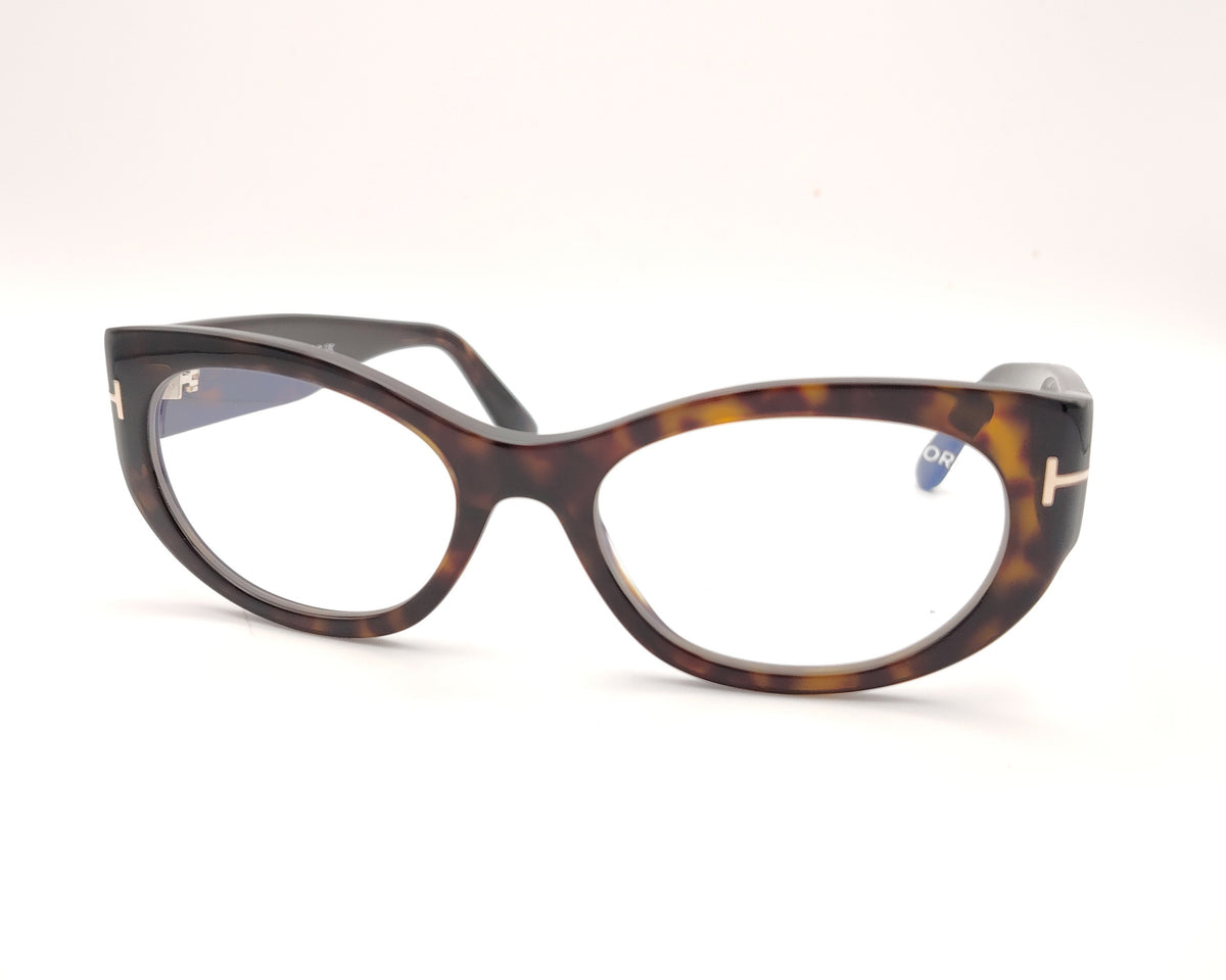 gafas tom ford ovaladas de acetato carey con varillas anchas y detalle metálico en las patillas