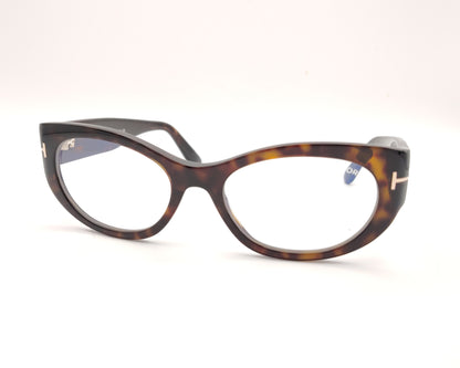 gafas tom ford ovaladas de acetato carey con varillas anchas y detalle metálico en las patillas