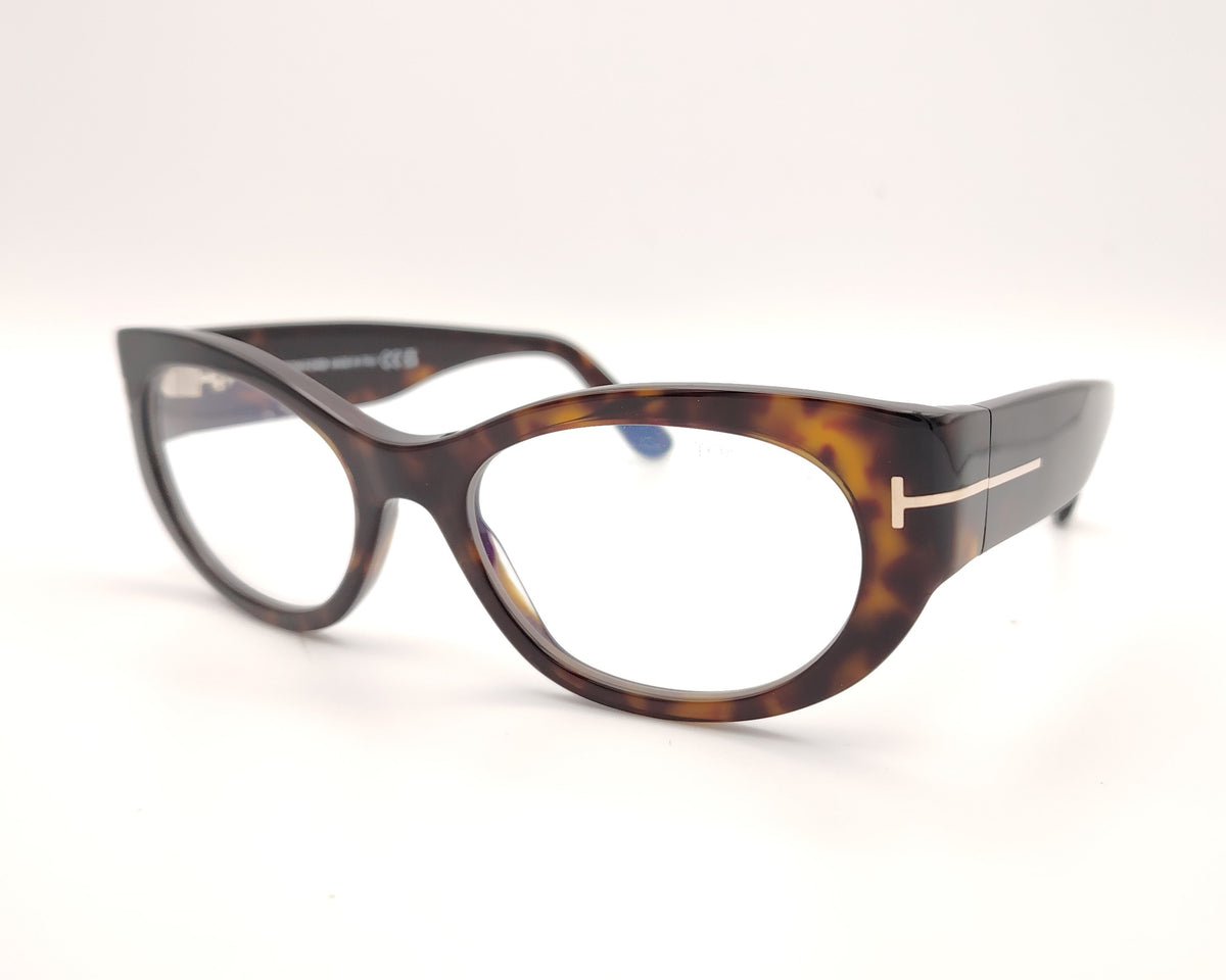 gafas tom ford ovaladas de acetato carey con varillas anchas y detalle metálico en las patillas