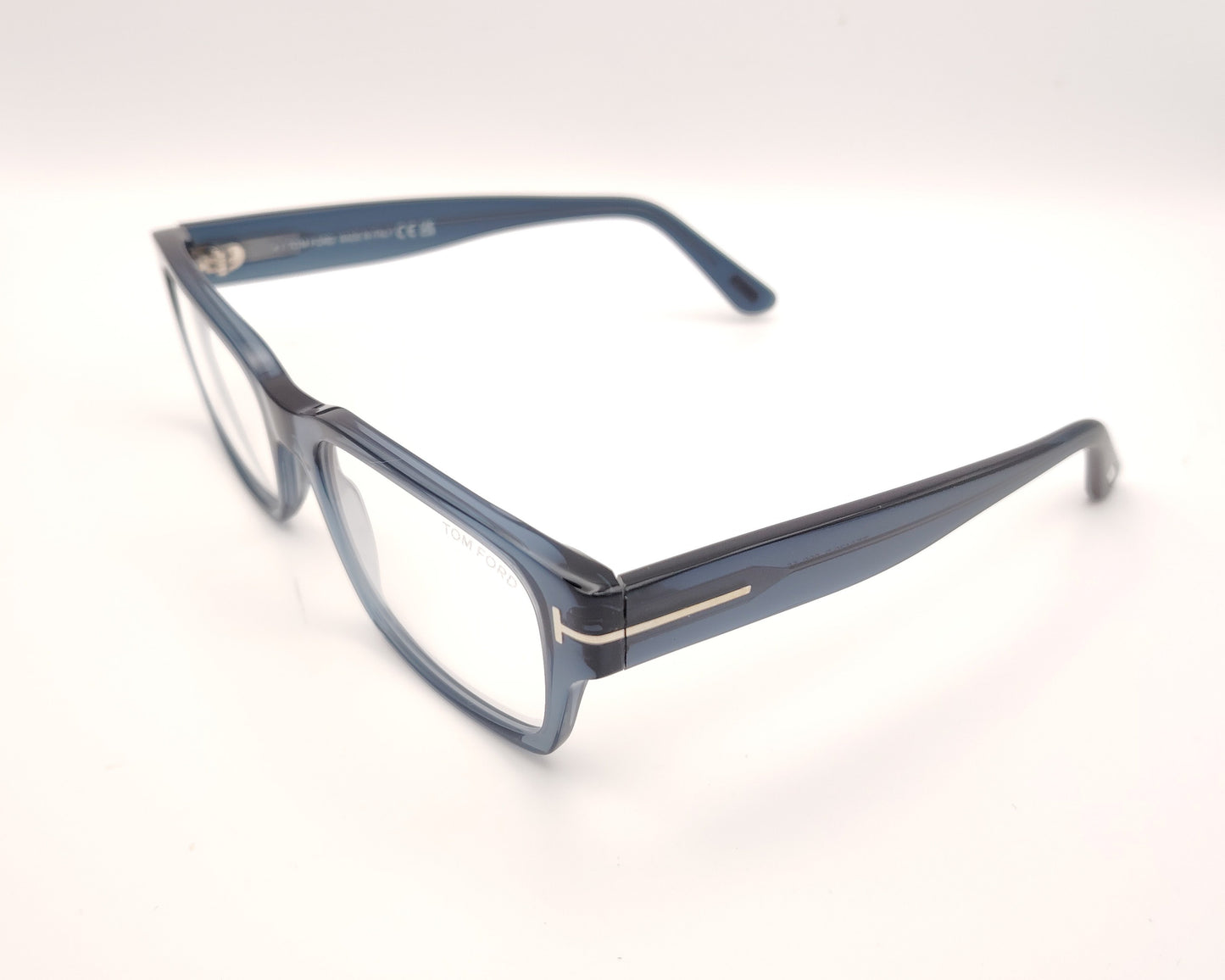 gafas graduadas tom ford rectangulares en azul translúcido con detalle metálico en las varillas