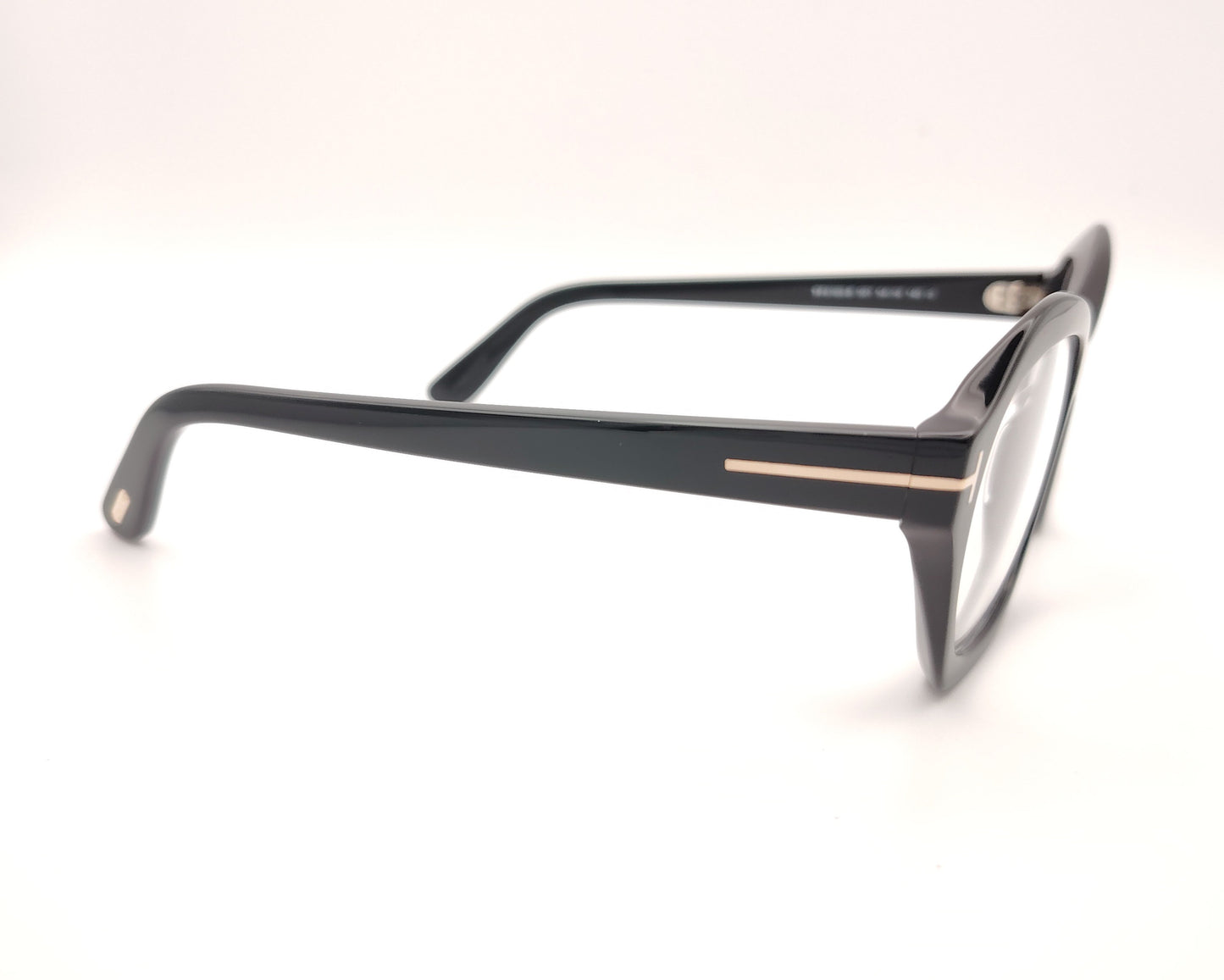 gafas tom ford negras de acetato con frontal geométrico redondeado y detalle metálico en las varillas