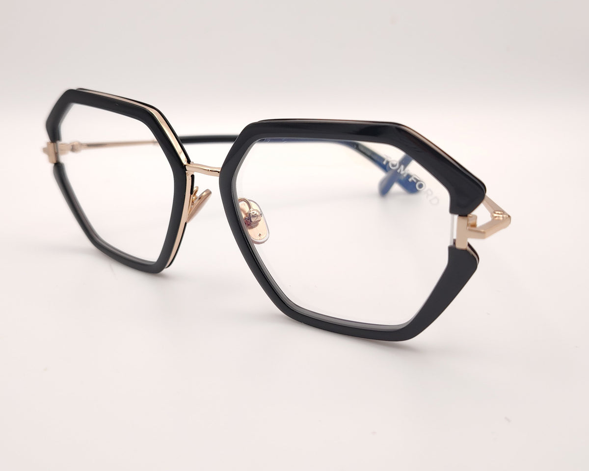 gafas tom ford geométricas negras oversize con detalles dorados y puente metálico