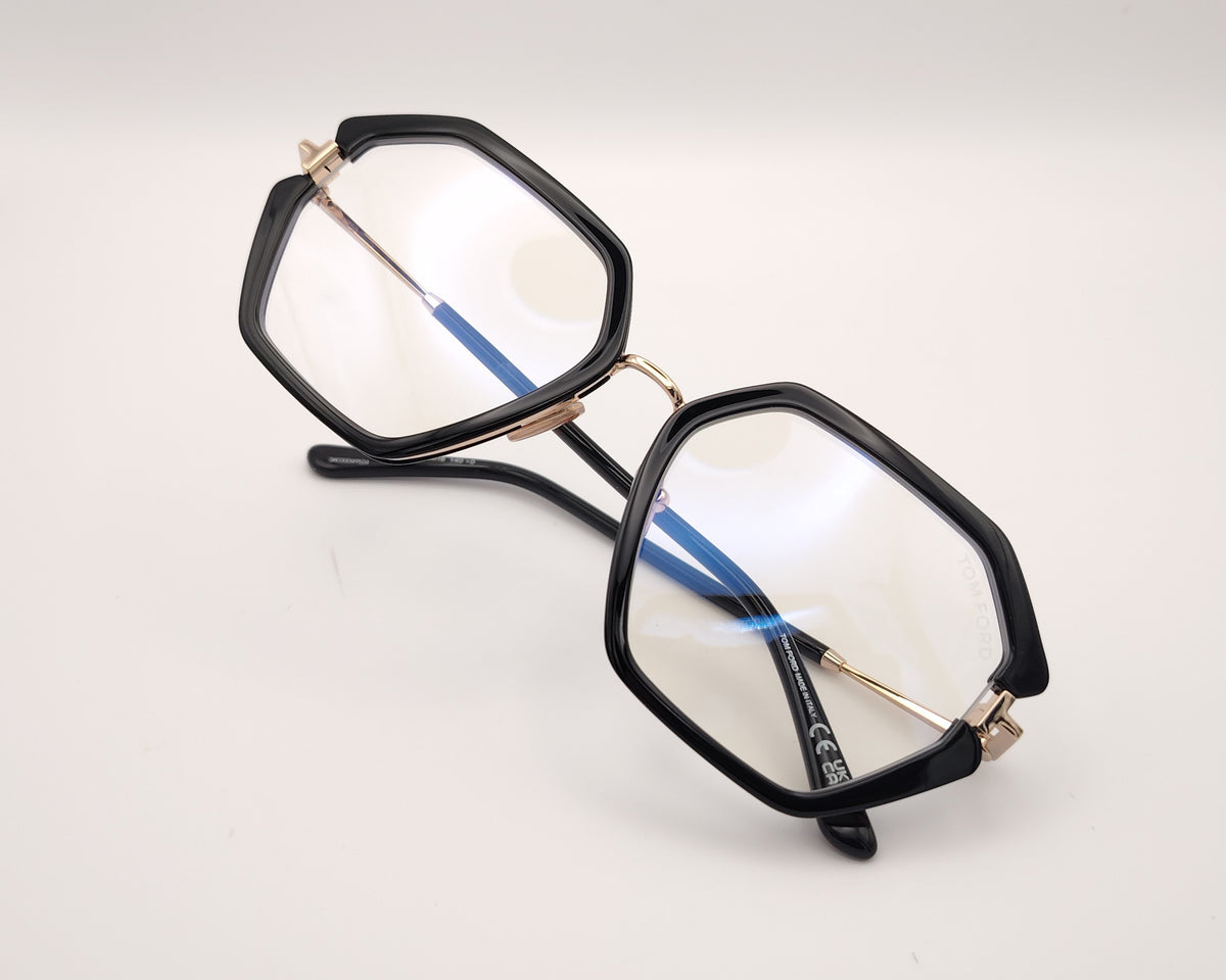 gafas tom ford geométricas negras oversize con detalles dorados y puente metálico