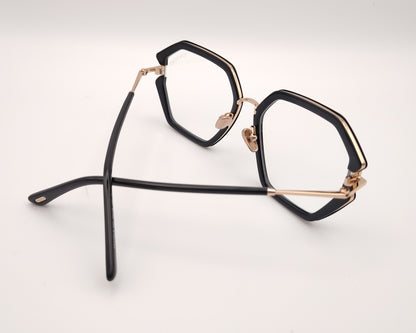 gafas tom ford geométricas negras oversize con detalles dorados y puente metálico