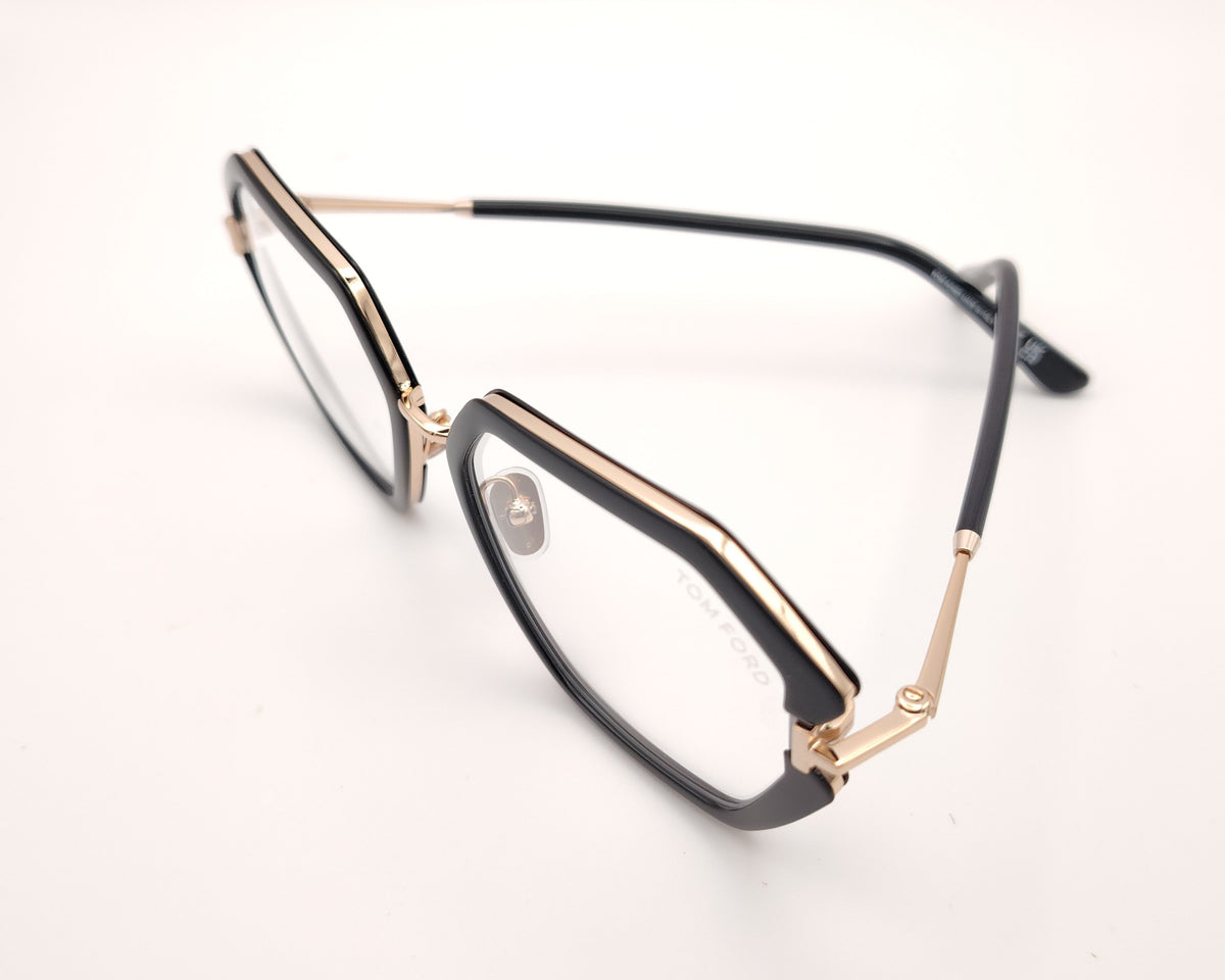 gafas tom ford geométricas negras oversize con detalles dorados y puente metálico
