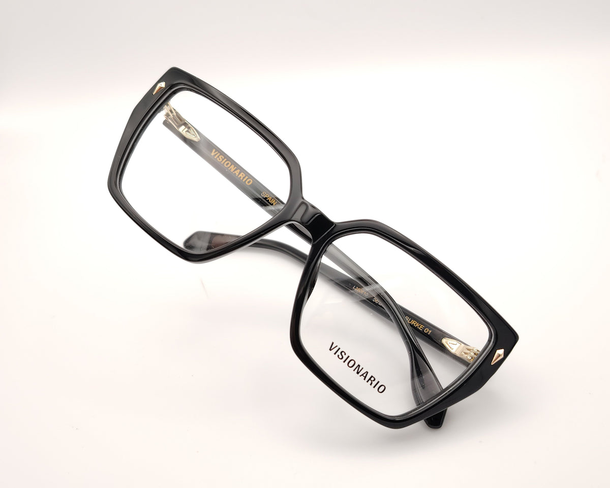 gafas de pasta negras con forma rectangular y detalle dorado en las esquinas delanteras, modelo visionario