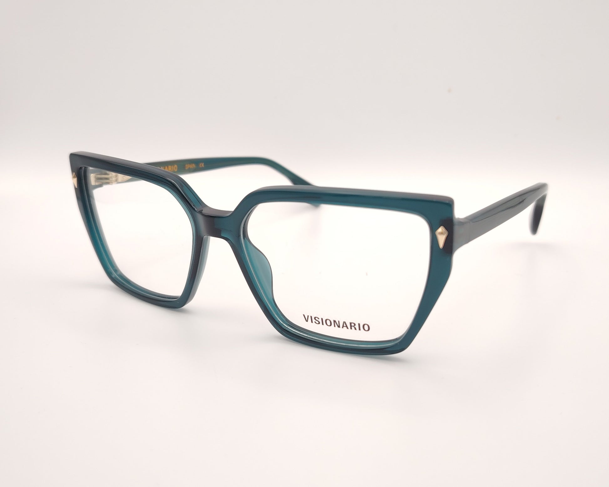 gafas de vista en acetato verde petróleo con forma trapezoidal y detalles metálicos dorados