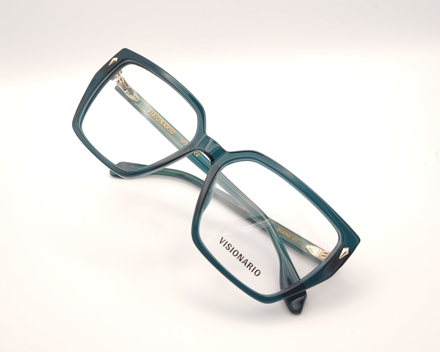 gafas de vista en acetato verde petróleo con forma trapezoidal y detalles metálicos dorados
