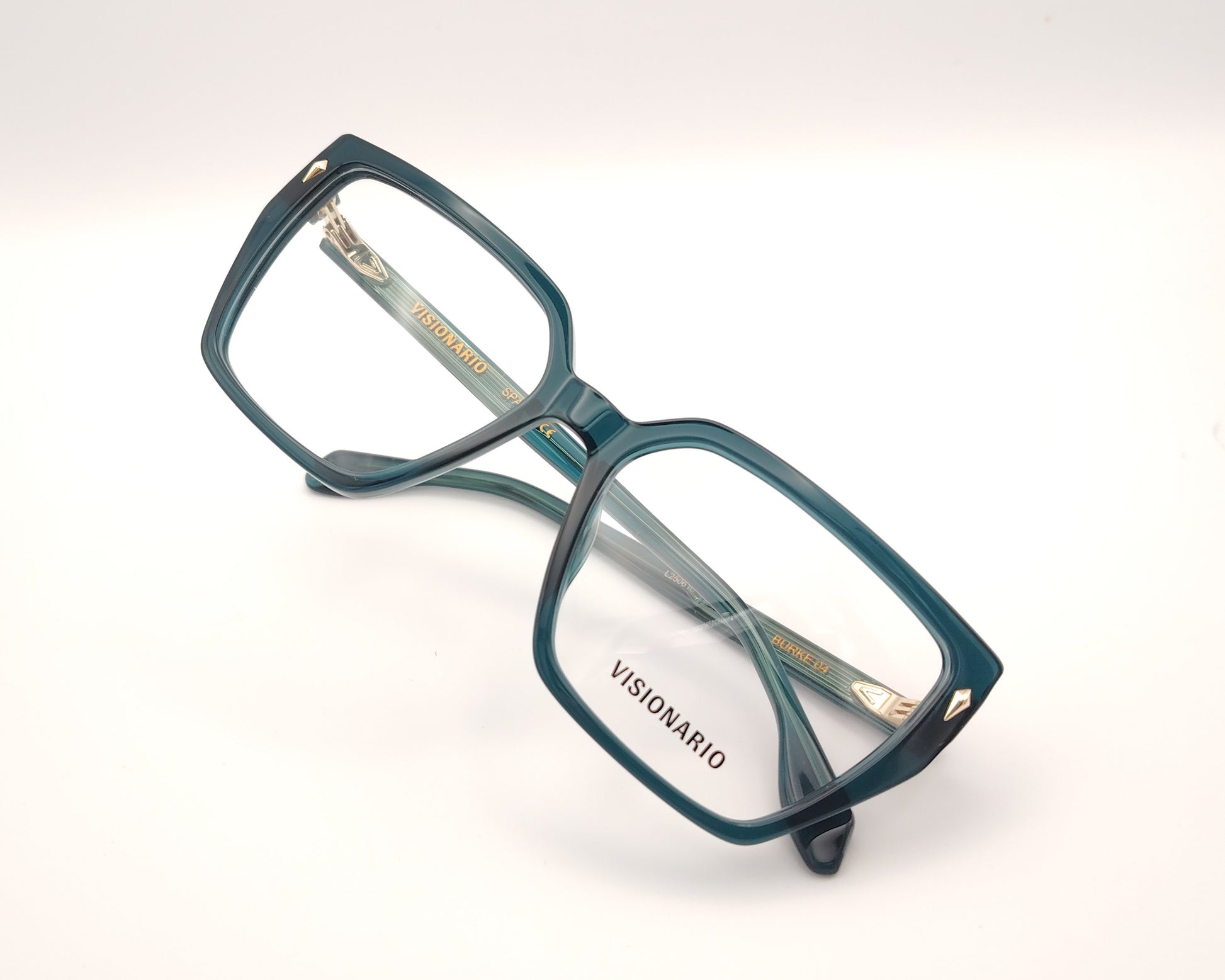 gafas de vista en acetato verde petróleo con forma trapezoidal y detalles metálicos dorados